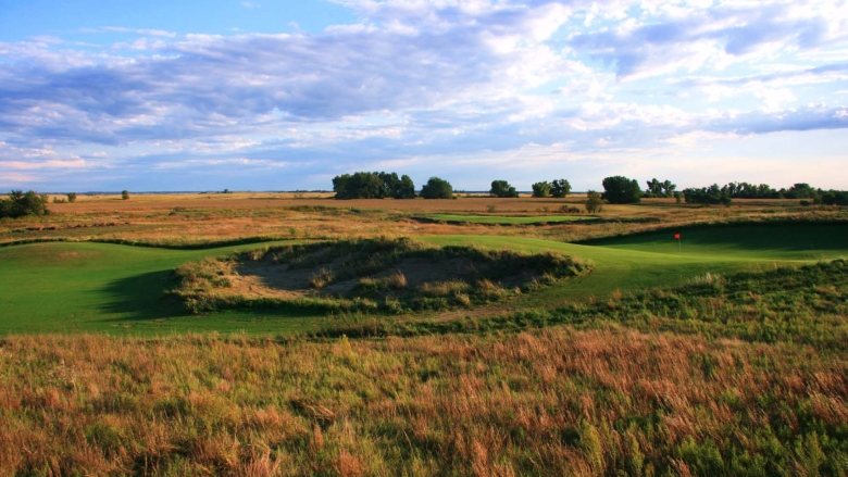 Awarii Dunes Golf Course with Scottish Links under a cloudy sky.